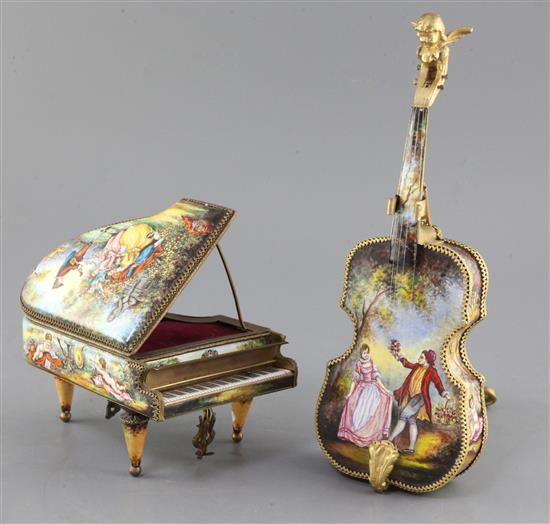 Two 20th century Viennese enamel musical boxes, in the form of a piano and a cello with stand, 6.5in. & 11.5in.